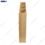 نمای کناری و گوشه از کتابخانه و شلف رو میزی کوچک انوشه